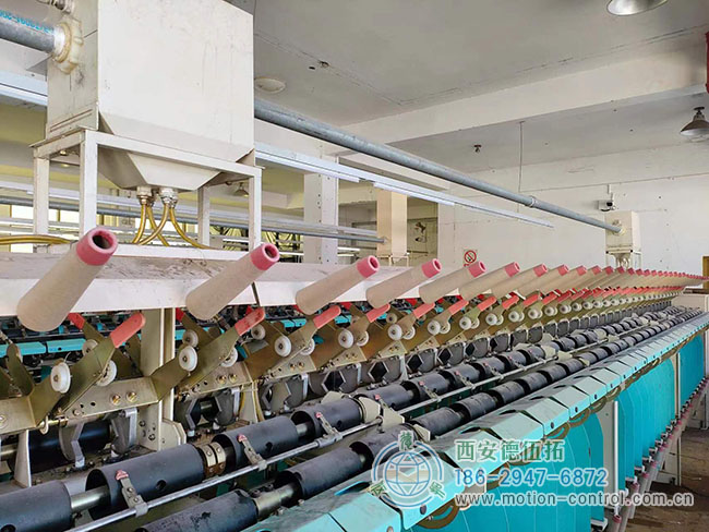 图为由编码器调节张力的关纱机照片